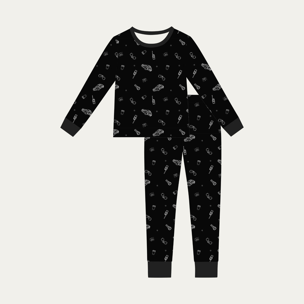 Black pajama set with white patterns on a light gray background