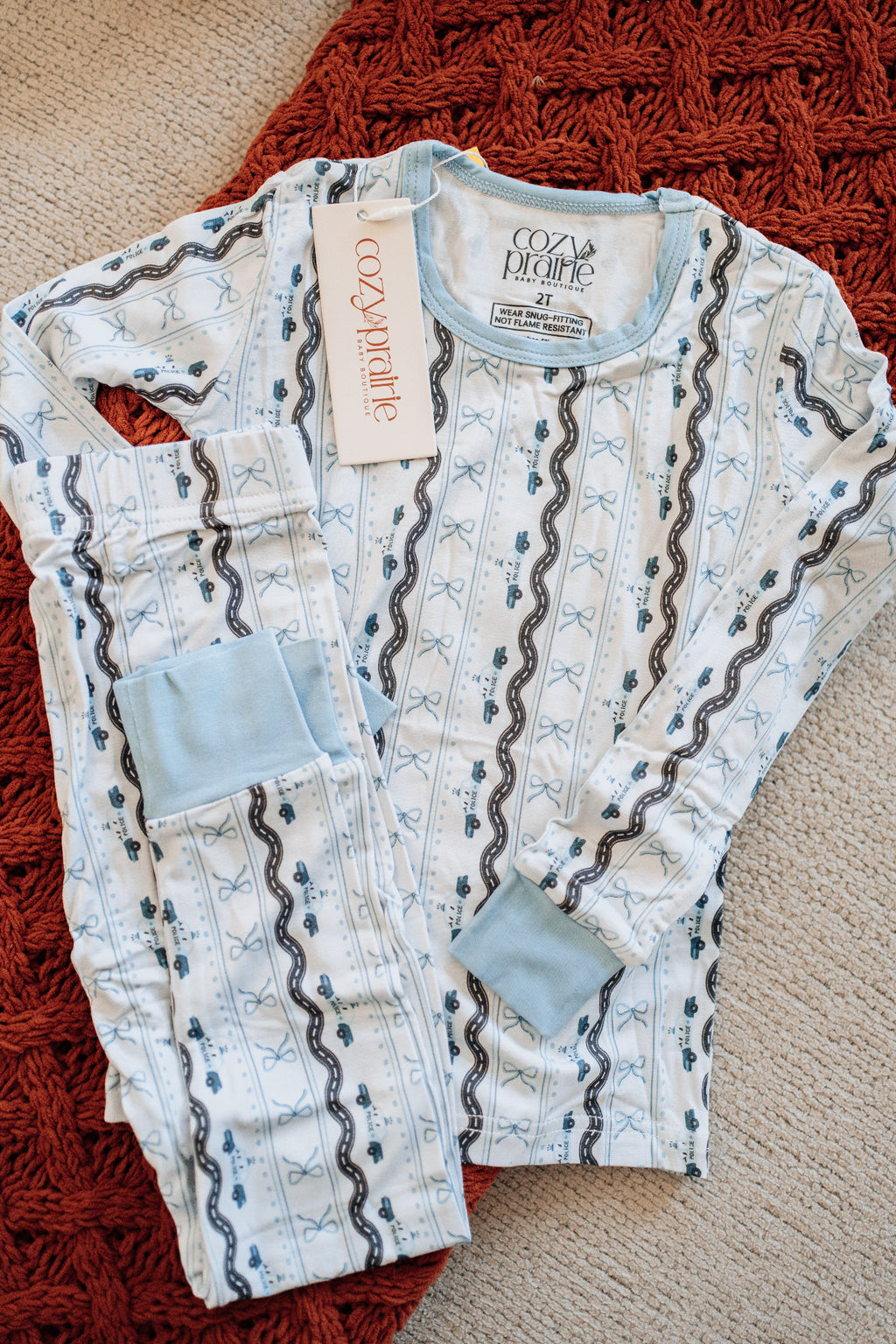 Baby onesie with a pattern on a textured surface