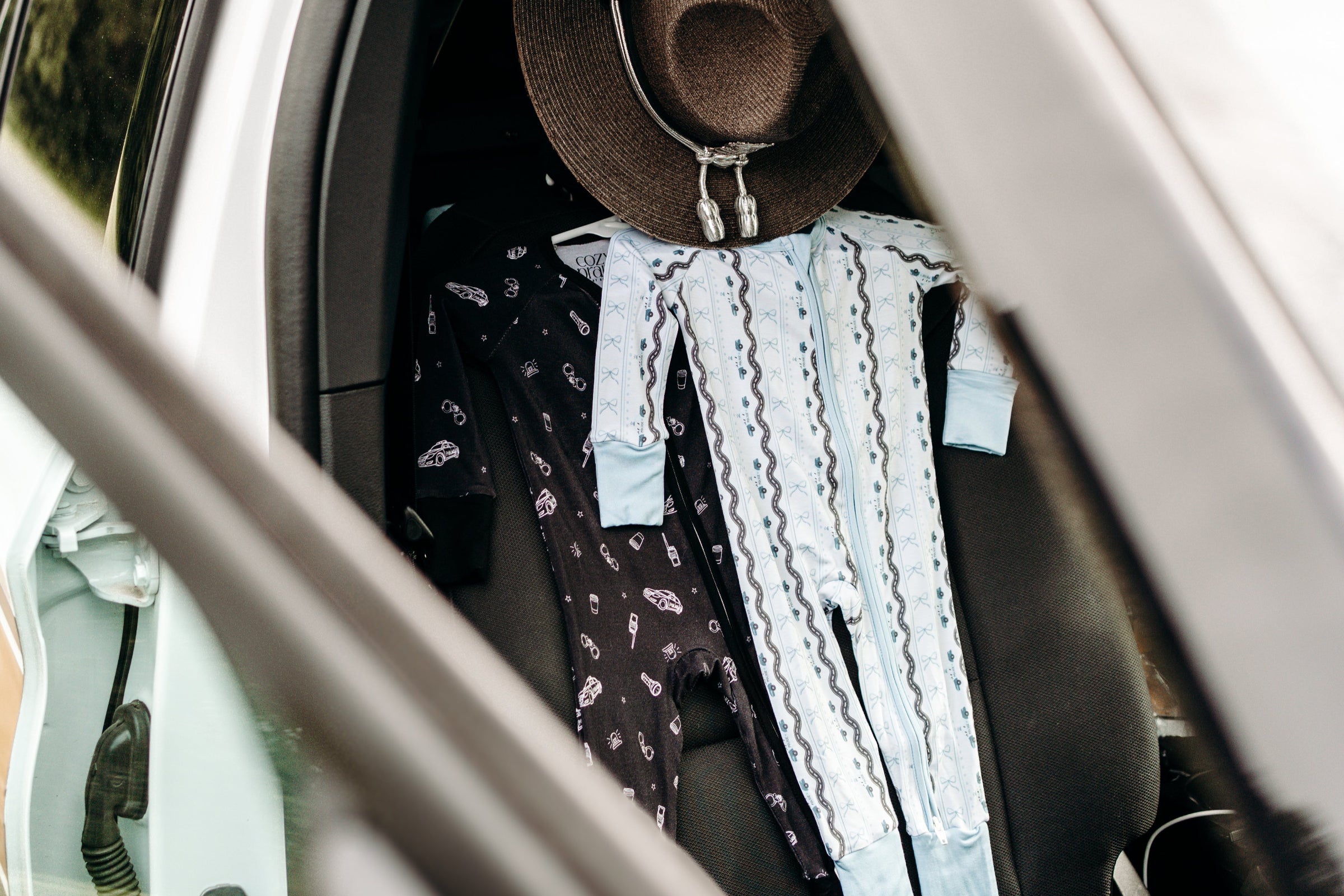 Two pajamas in police car